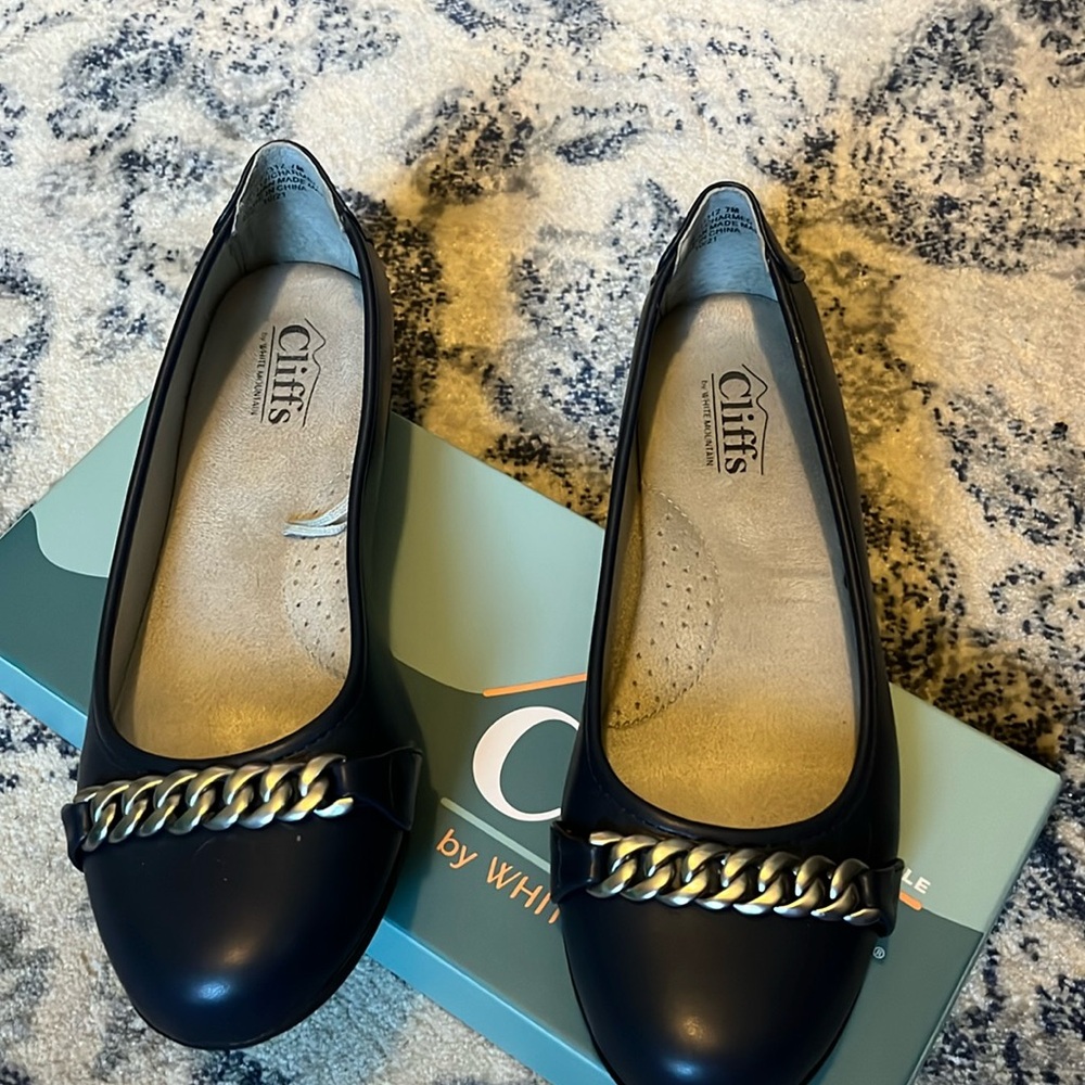 Dark blue flats.